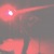 John Bonnell playing flute, red lights all around